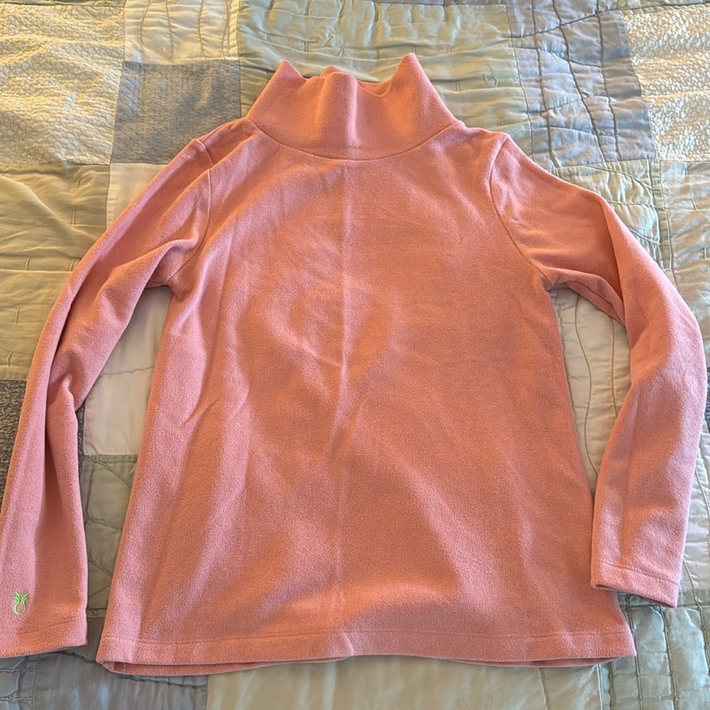 Dudley Stephen’s pink turtleneck
